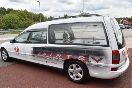 close up of white funeral car
